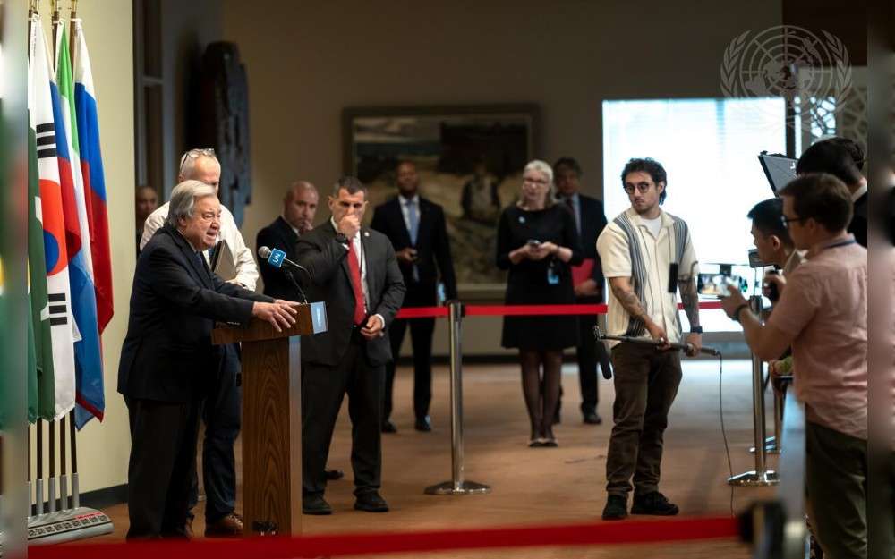 United Nations Secretary-General António Guterres (left at podium) briefs reporters on the 168 United Nations personnel who lost their lives in the line of duty during 2024.