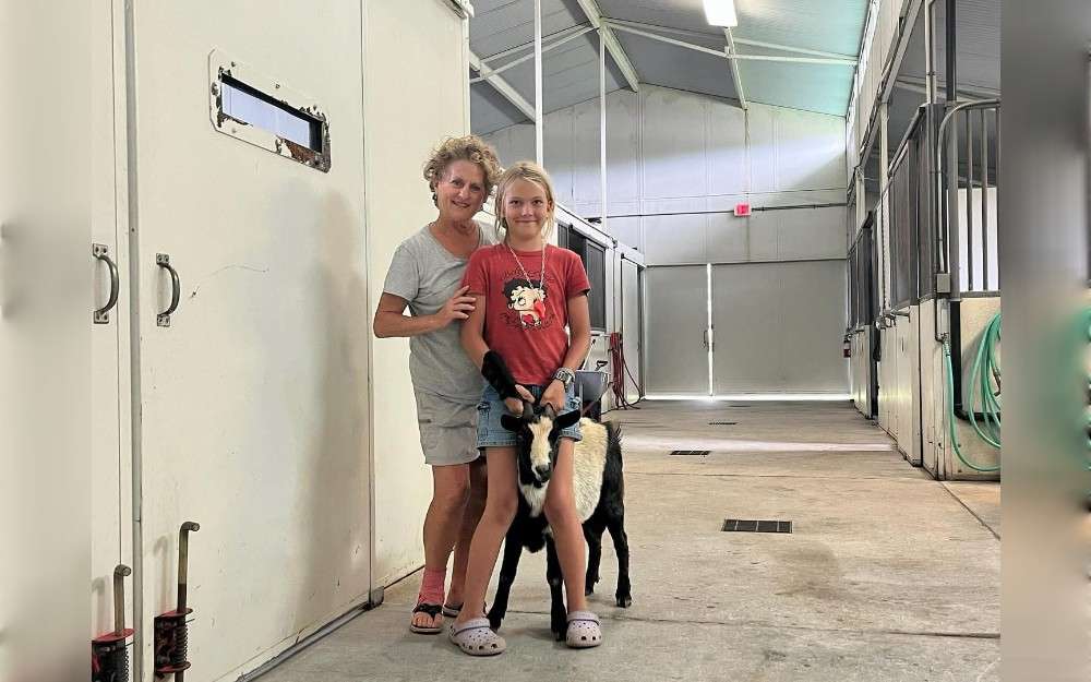 In order to finally wrestle the goat from a Hawi cliff,Hawaii,United States,volunteers employed a two-pronged strategy: by land and by sea. After rescuing her, they transported her to a veterinarian.