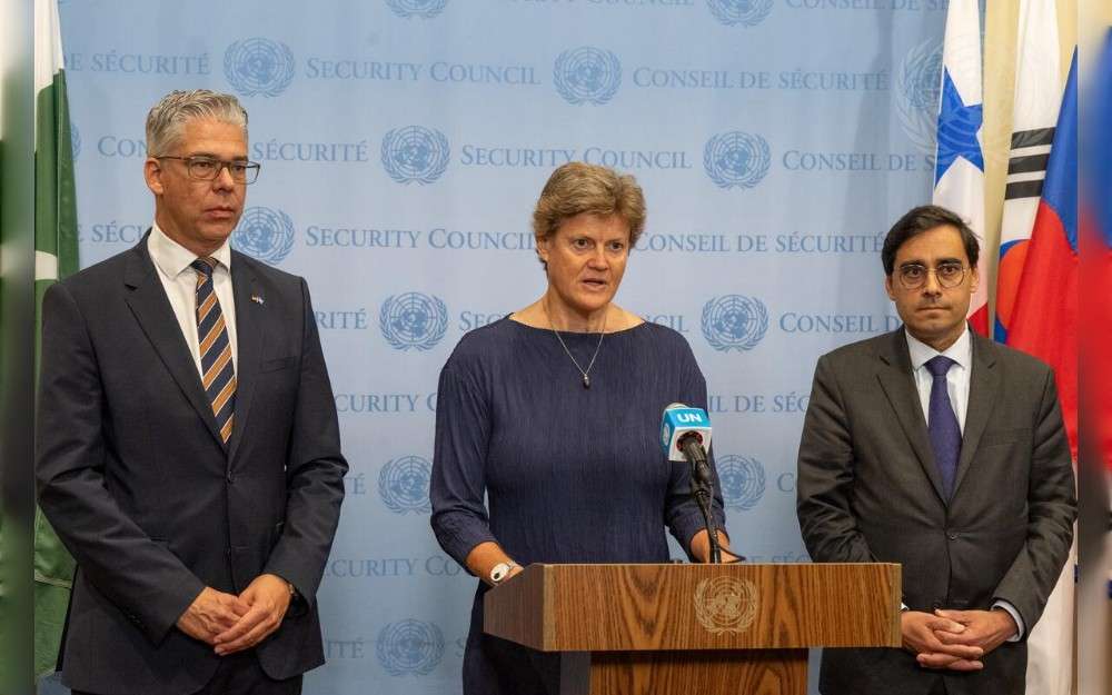 Barbara Woodward, Permanent Representative of the United Kingdom to the United Nations, briefs reporters at UN Headquarters. With her are Representatives of France and Germany 