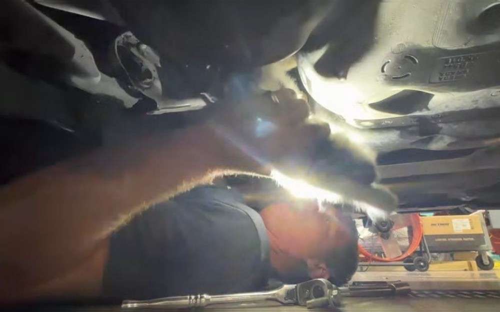 A kitten that had run out into the road in front of a car and jumped up to hide in the undercarriage was saved by the South Carolina's Bluffton County firefighters.